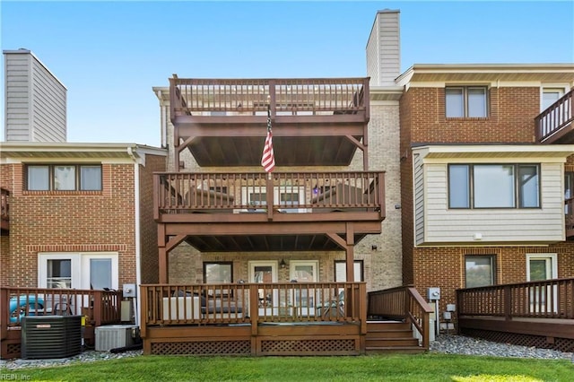 back of property featuring central AC, a yard, and a deck