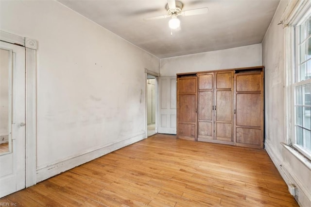 unfurnished bedroom featuring ceiling fan and light hardwood / wood-style flooring