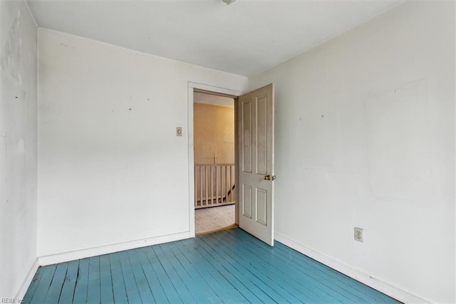 empty room featuring wood-type flooring