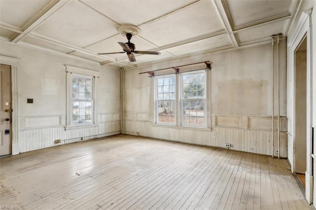 miscellaneous room featuring coffered ceiling, a wealth of natural light, ceiling fan, and light hardwood / wood-style flooring