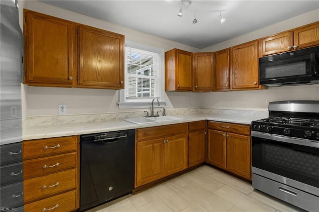 kitchen with sink and black appliances