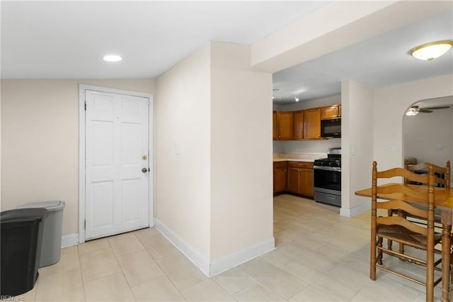 kitchen with gas stove and ceiling fan