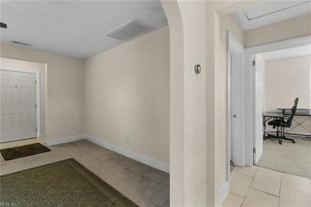 view of carpeted foyer entrance