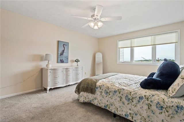 bedroom with ceiling fan and carpet