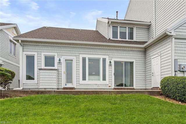 rear view of house with a lawn