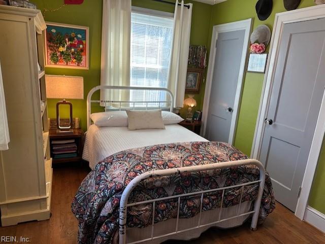 bedroom featuring dark hardwood / wood-style floors