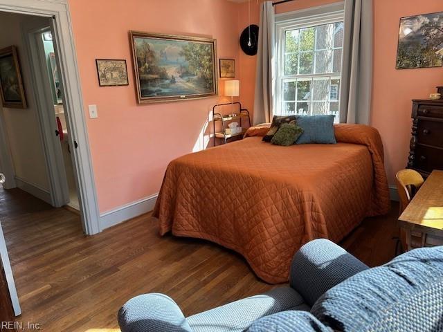 bedroom with hardwood / wood-style floors