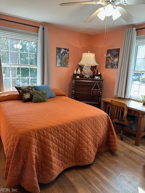 bedroom with hardwood / wood-style flooring and ceiling fan