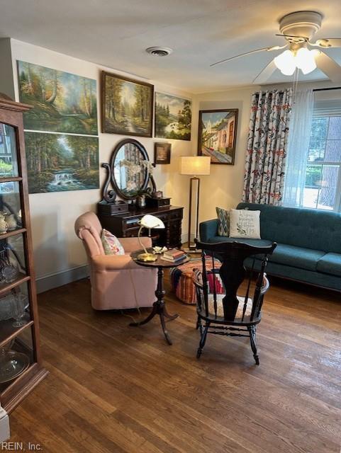 living room with ceiling fan and hardwood / wood-style floors