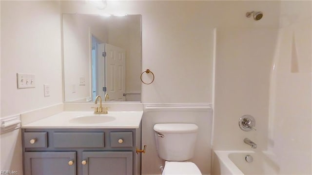 full bathroom featuring vanity, tub / shower combination, and toilet