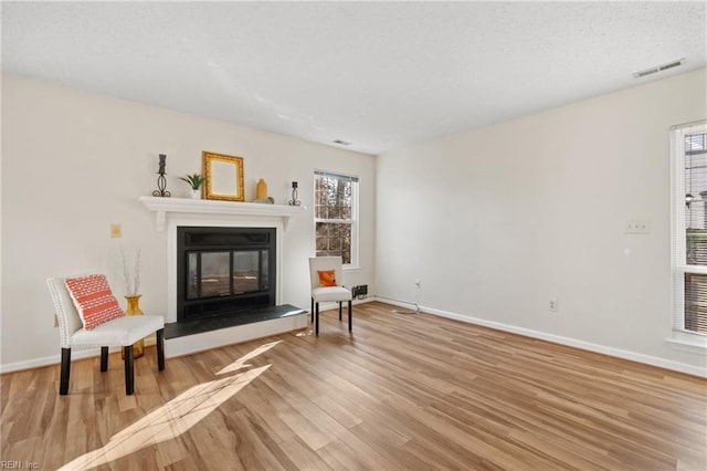 living area with light hardwood / wood-style floors