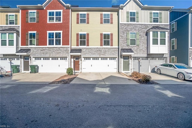 townhome / multi-family property featuring a garage