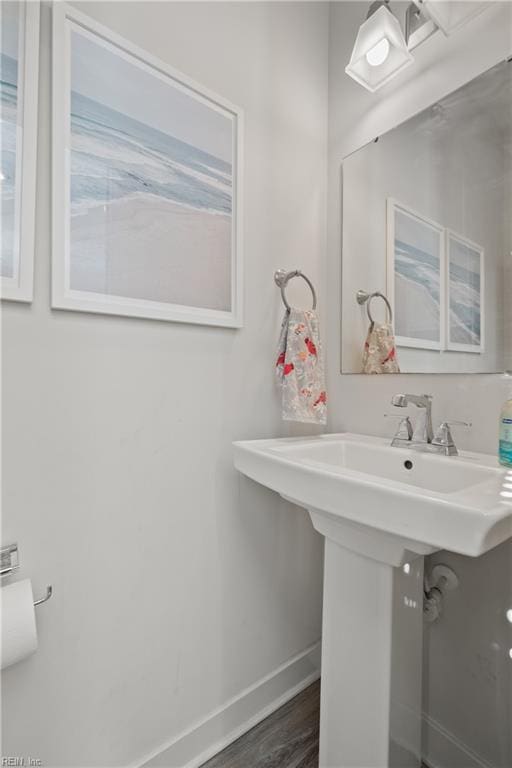 bathroom featuring sink and hardwood / wood-style flooring