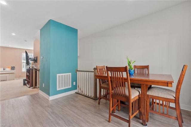 dining area with light hardwood / wood-style flooring