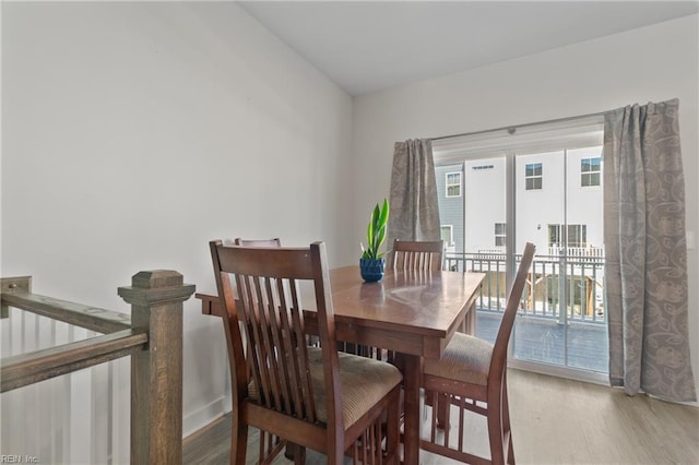 dining space featuring wood-type flooring