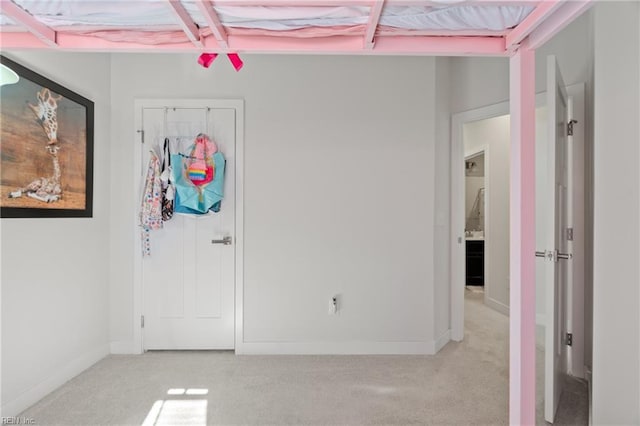 interior space featuring light colored carpet