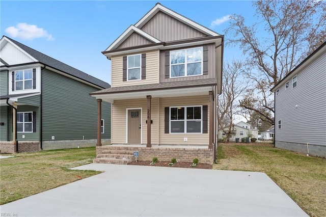 craftsman-style home with a porch and a front yard