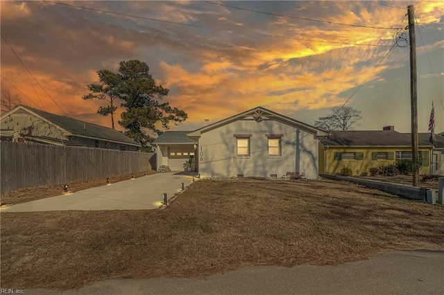 view of front facade with a garage and a lawn