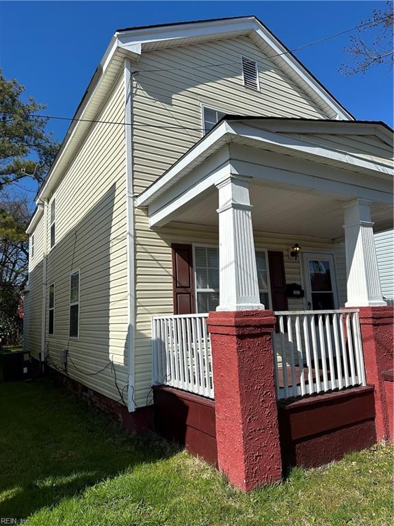 view of side of property with a porch