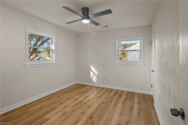 spare room featuring light hardwood / wood-style flooring and ceiling fan