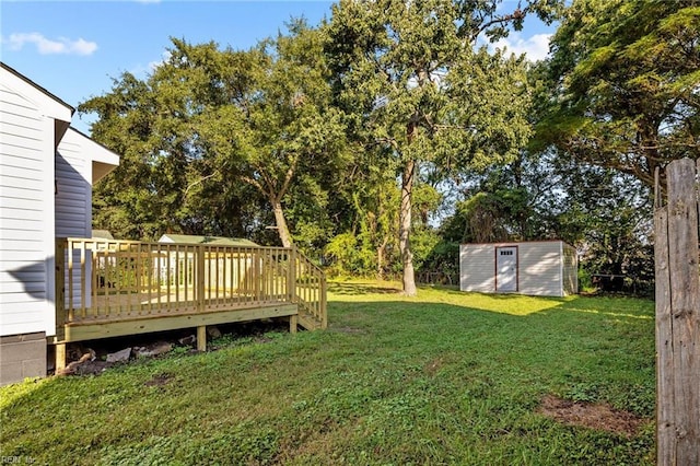 view of yard featuring a storage shed and a deck