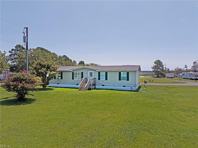 manufactured / mobile home with a front lawn