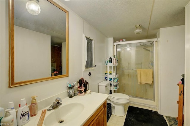 bathroom featuring vanity, toilet, a textured ceiling, and walk in shower