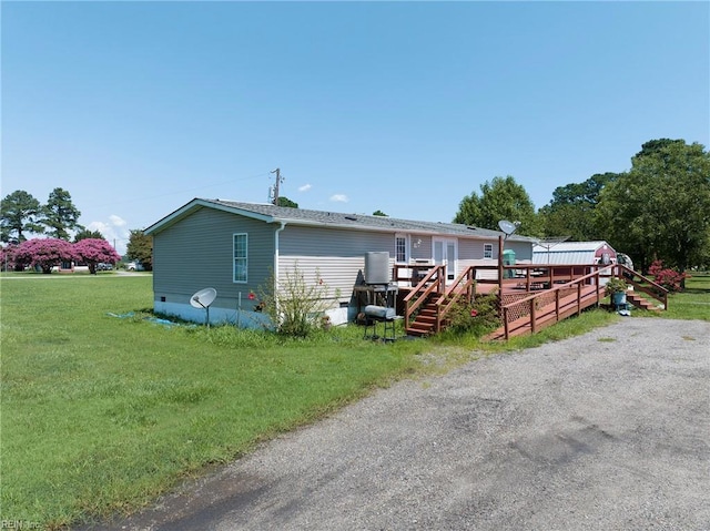 exterior space with a yard and a deck