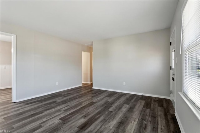 unfurnished room featuring dark hardwood / wood-style floors