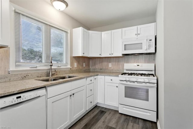 kitchen with sink, white appliances, white cabinetry, dark hardwood / wood-style floors, and light stone countertops