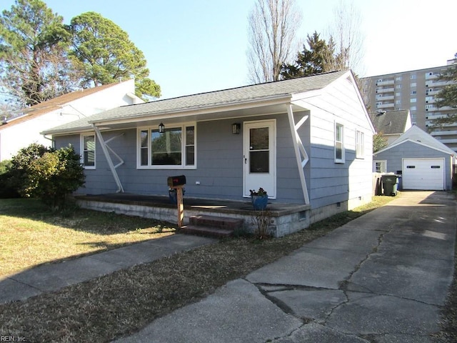 view of front facade featuring a garage and an outdoor structure