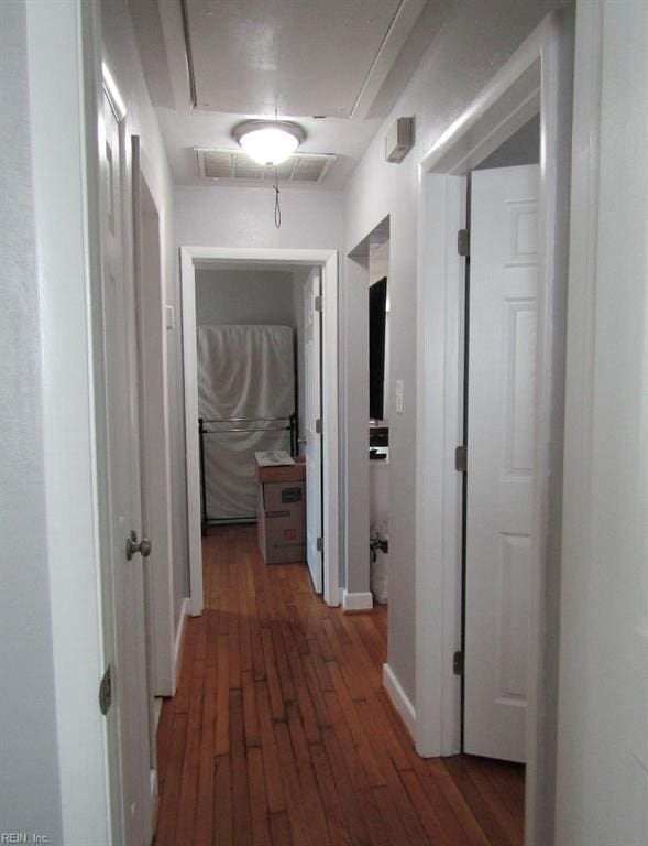 hall with dark hardwood / wood-style floors