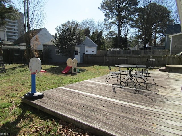 wooden deck featuring a yard