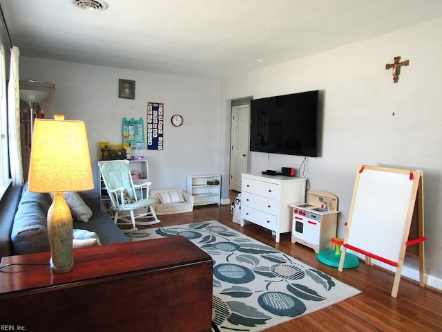 living room with dark wood-type flooring