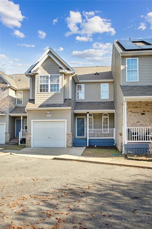 townhome / multi-family property featuring a garage