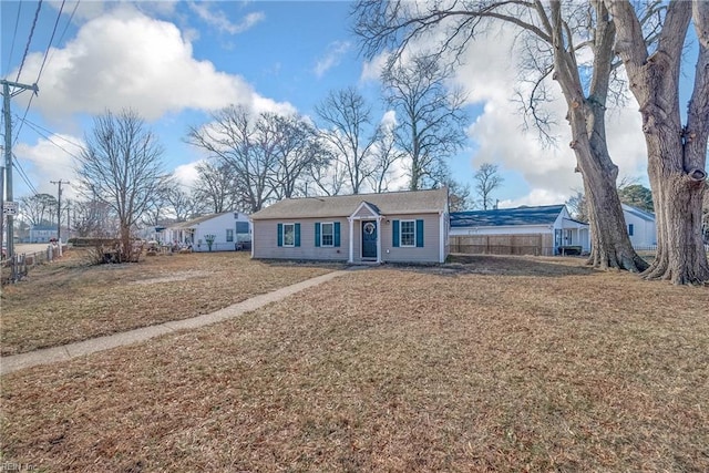 ranch-style house with a front lawn