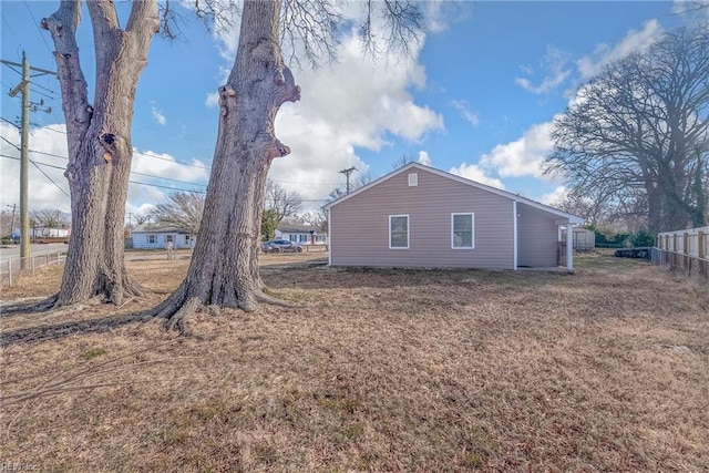 view of property exterior with a yard