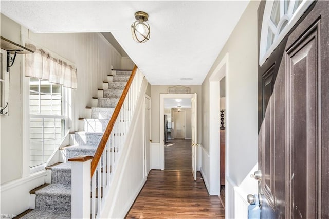 stairway featuring hardwood / wood-style flooring