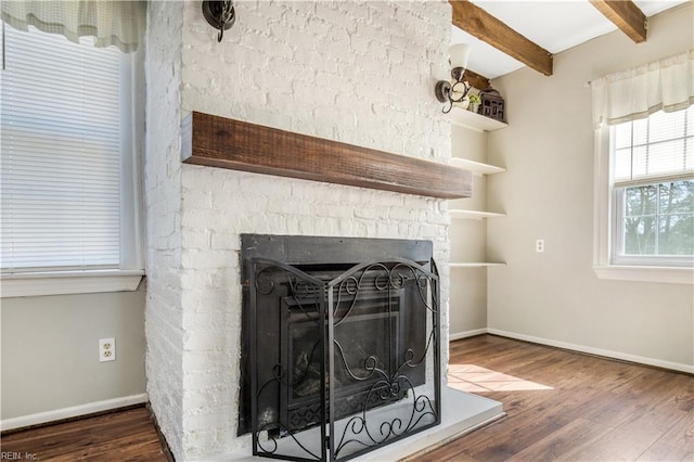 details with hardwood / wood-style flooring and a fireplace