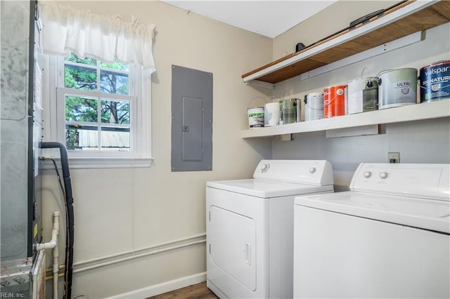 washroom featuring electric panel and washer and dryer