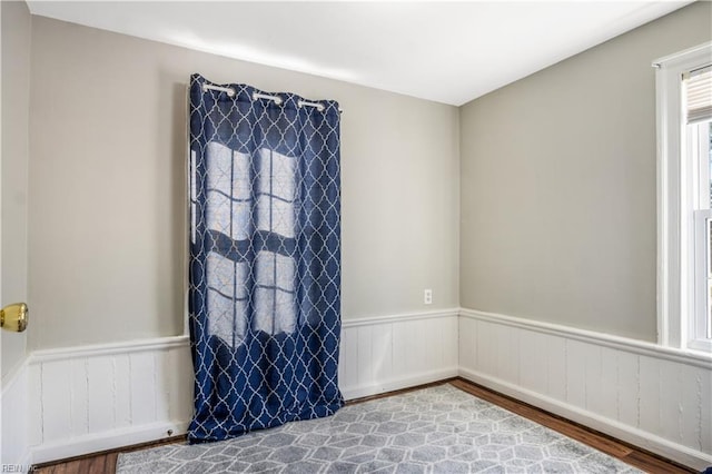 unfurnished room featuring hardwood / wood-style flooring