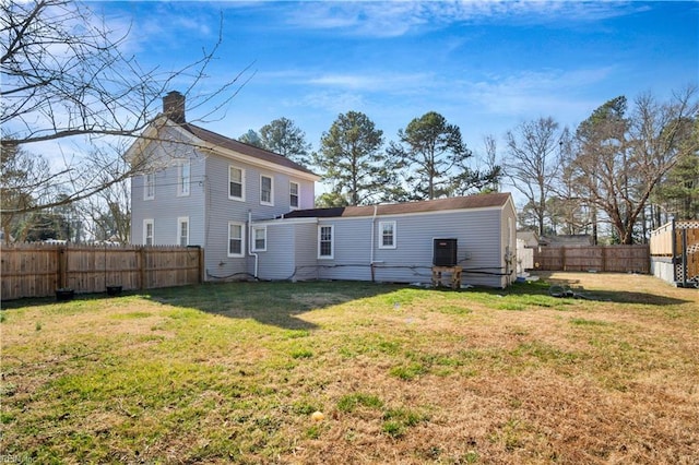 back of house with a yard