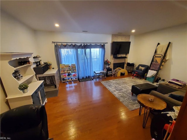 living room featuring a fireplace and hardwood / wood-style floors