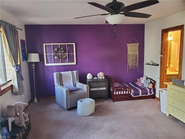 bedroom featuring ceiling fan and carpet