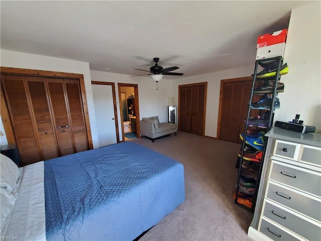 bedroom with multiple closets and ceiling fan