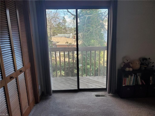 entryway featuring carpet flooring