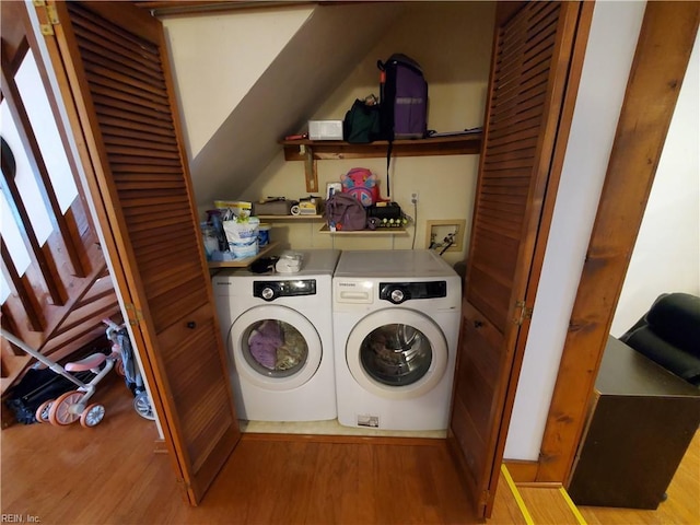 clothes washing area featuring separate washer and dryer and light wood-type flooring