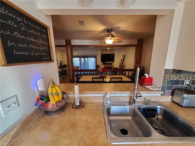 kitchen with ceiling fan and sink