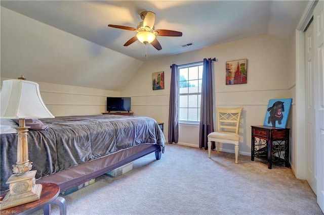 bedroom featuring lofted ceiling, light carpet, and ceiling fan