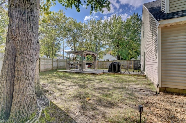 view of yard featuring a wooden deck and a gazebo